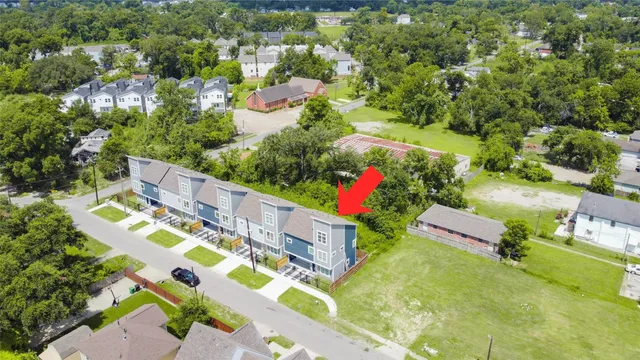 an aerial view of residential house with outdoor space and street view