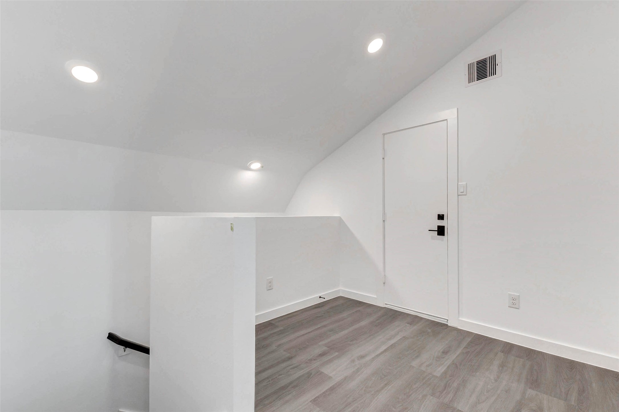 6017 Beall Street Houston, TX 77091 - Photo 23 of 33 This top-floor flex space is ready for anything home office, workout zone, creative studio, or cozy den. Vaulted ceilings and recessed lighting make it a bright and functional bonus level.