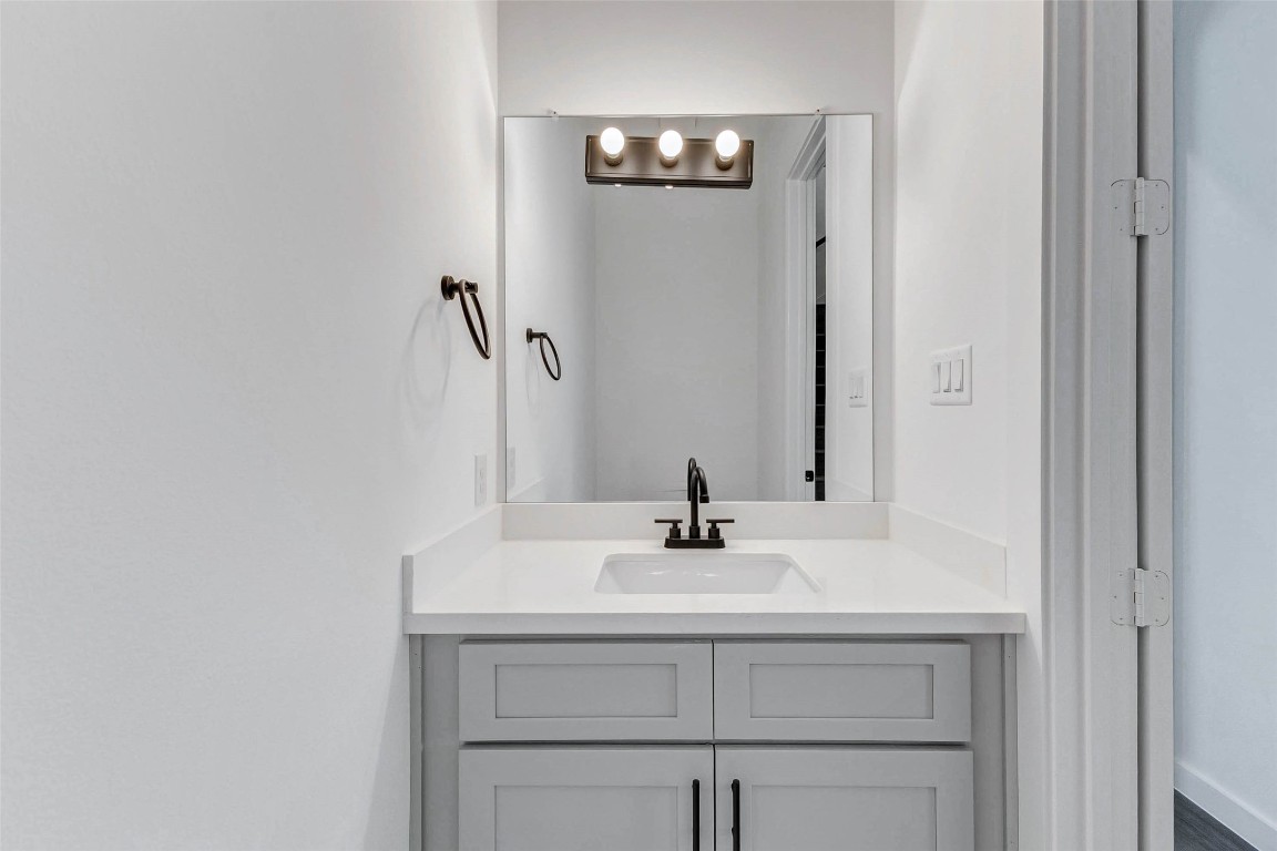 6017 Beall Street Houston, TX 77091 - Photo 26 of 33 a bathroom with a sink and a mirror