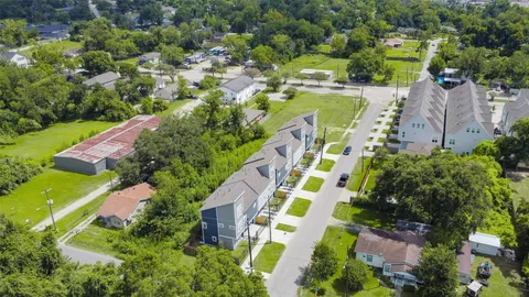 an aerial view of residential house with outdoor space and swimming pool