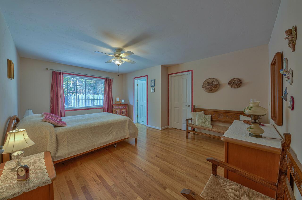 26382 Riverside Place Carmel, CA 93923 - Photo 16 of 29 a bedroom with a bed window and dresser