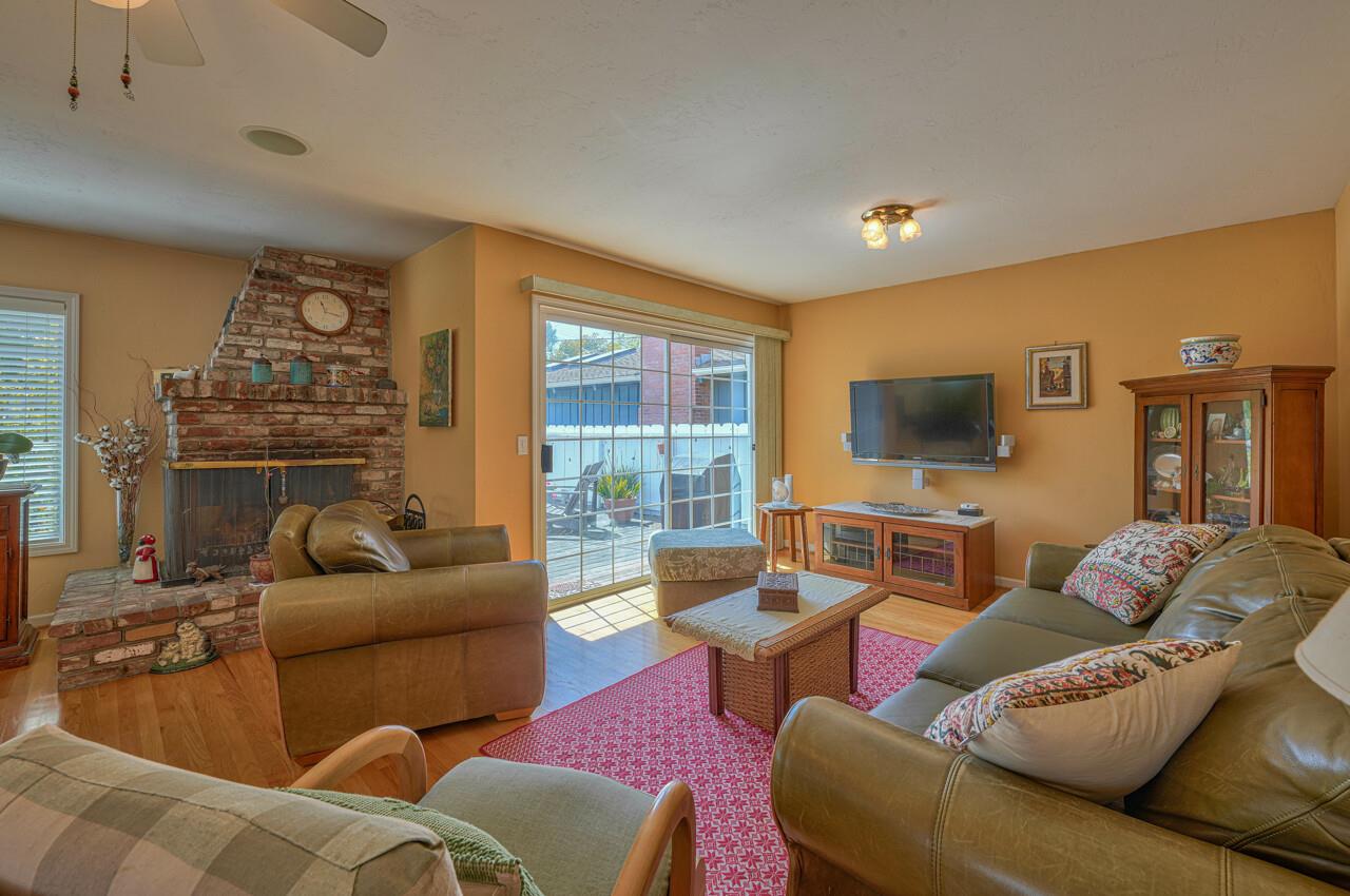 26382 Riverside Place Carmel, CA 93923 - Photo 6 of 29 a living room with furniture and a flat screen tv