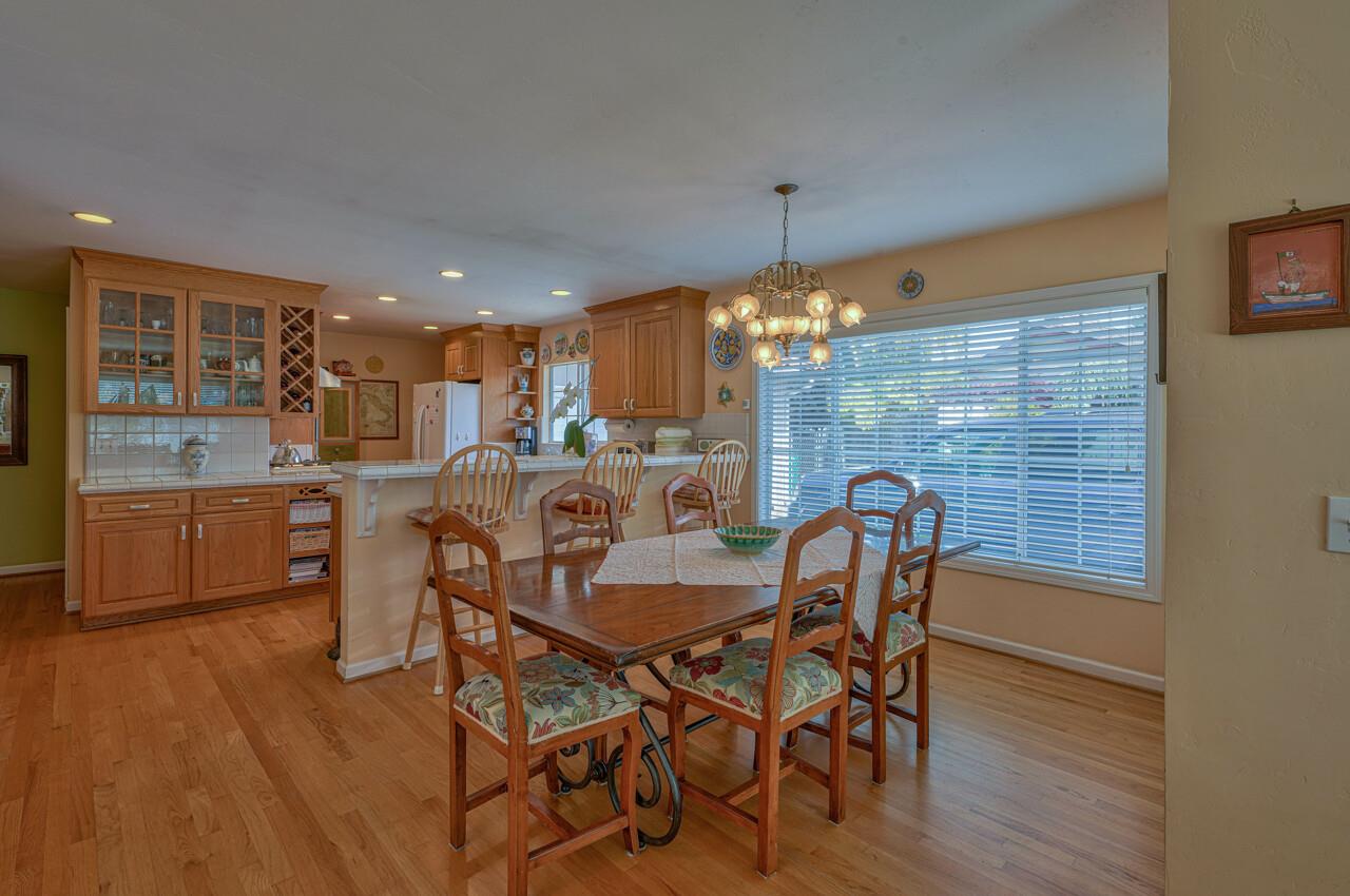 26382 Riverside Place Carmel, CA 93923 - Photo 9 of 29 a view of a dining room with furniture and chandelier