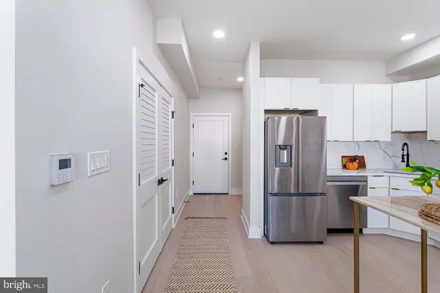 a bathroom with a tub and shower