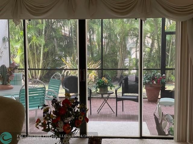 Oaktree Estates Oakland Park, FL 33309 - Photo 13 of 17 a view of a porch with chairs and backyard