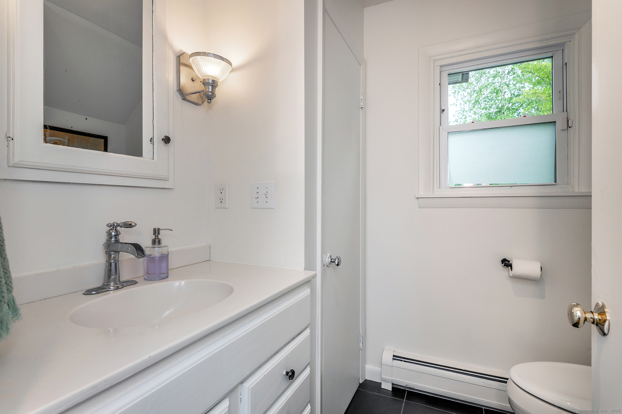 17 Rhynus Road Sharon, CT 06069 - Photo 12 of 30 a bathroom with a sink a toilet and a mirror