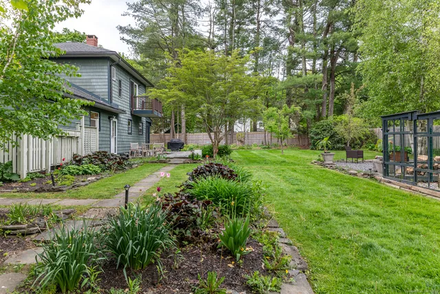 a backyard of a house with lots of green space