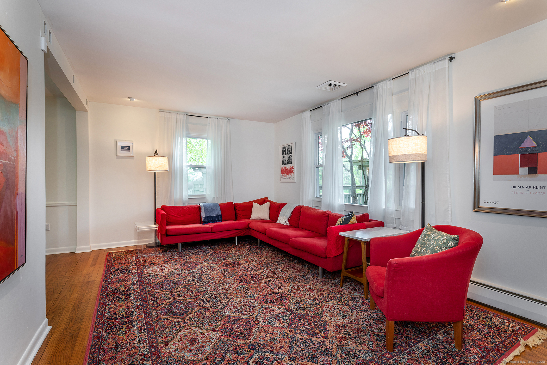 17 Rhynus Road Sharon, CT 06069 - Photo 5 of 30 a living room with furniture a rug and a chandelier