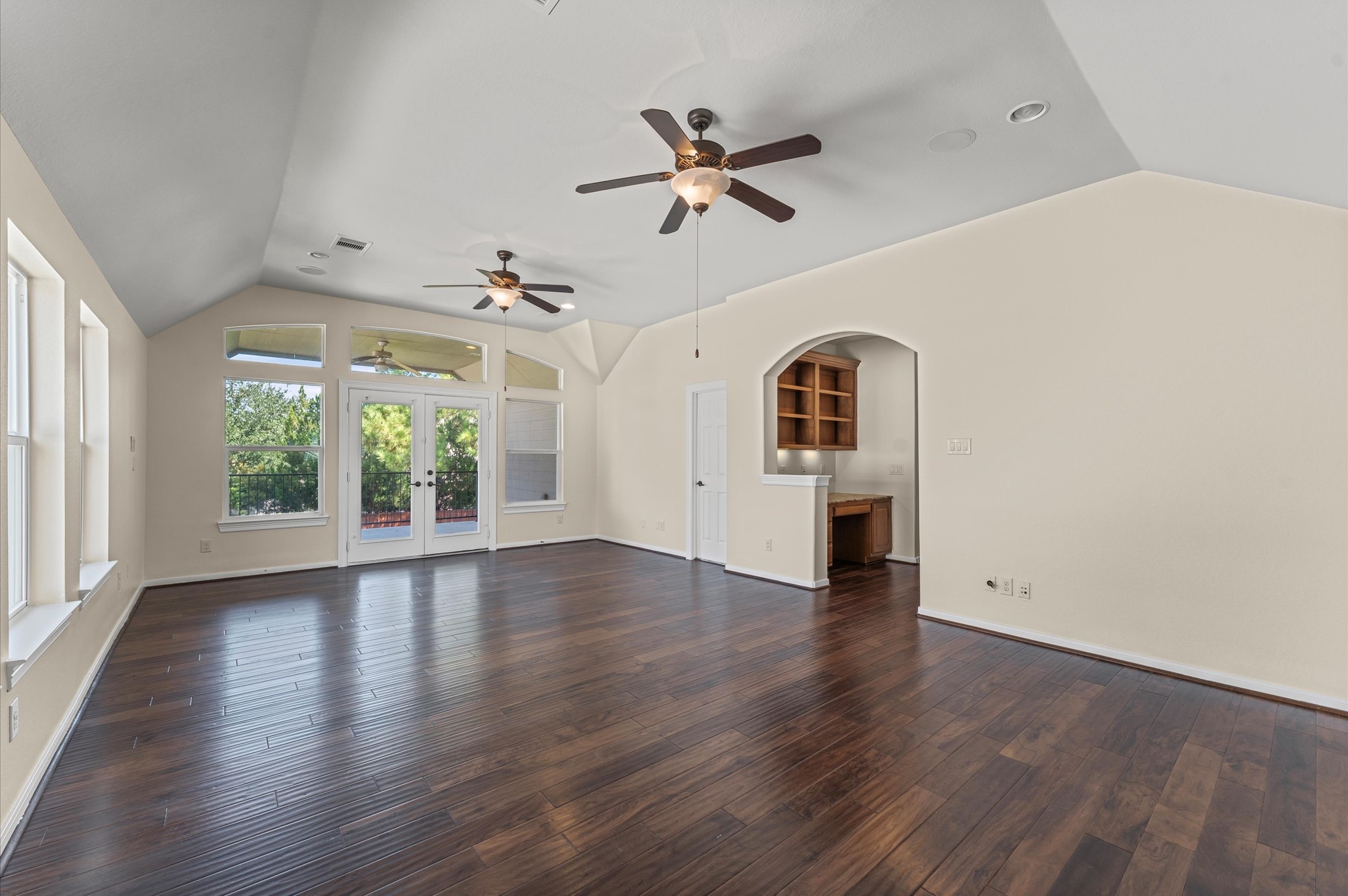 7 North Beech Springs Circle Spring, TX 77389 - Photo 10 of 50 an empty room with wooden floor fan and windows