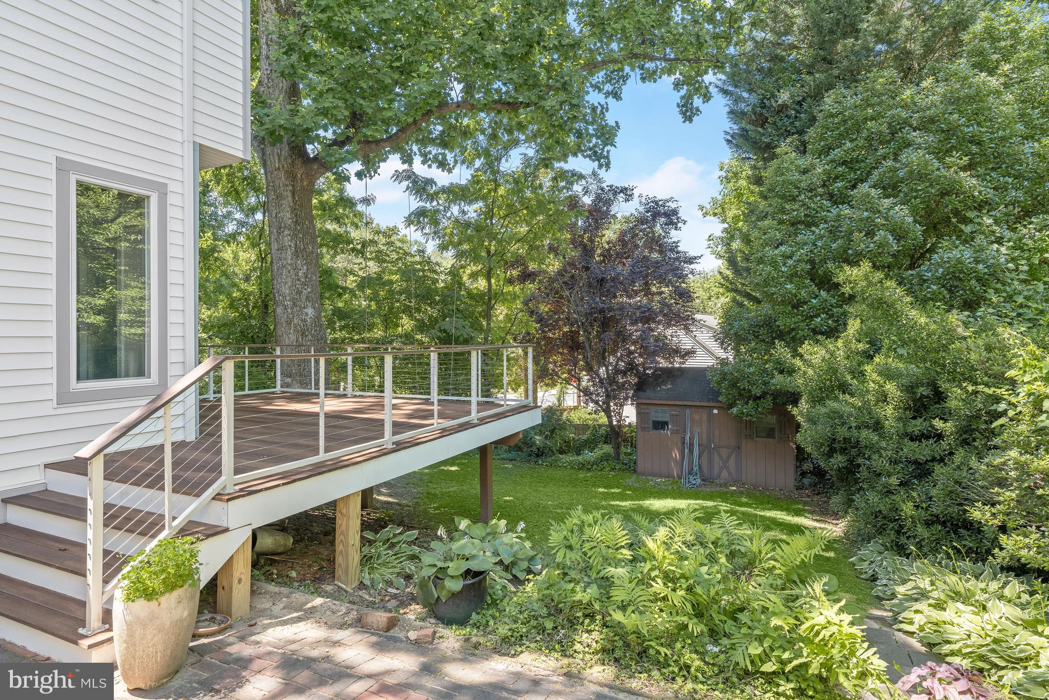 8800 Maywood Avenue Silver Spring, MD 20910 - Photo 34 of 41 a wooden deck with trees in front of it