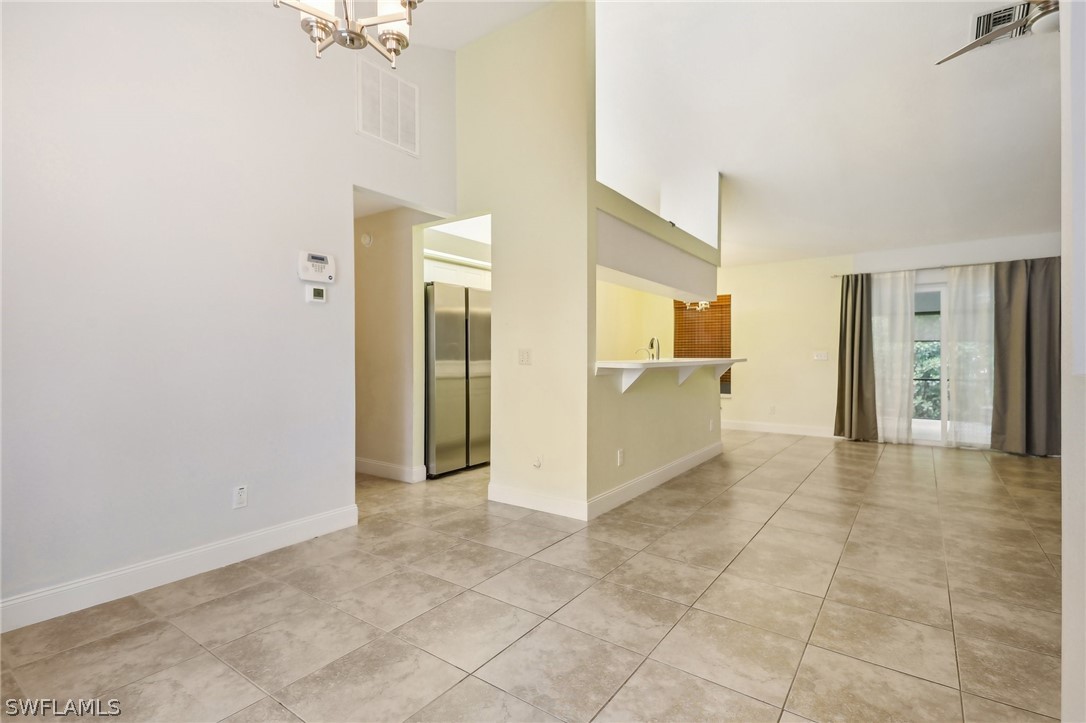 18364 Camellia Road Fort Myers, FL 33967 - Photo 11 of 48 a view of a big room with closet and windows