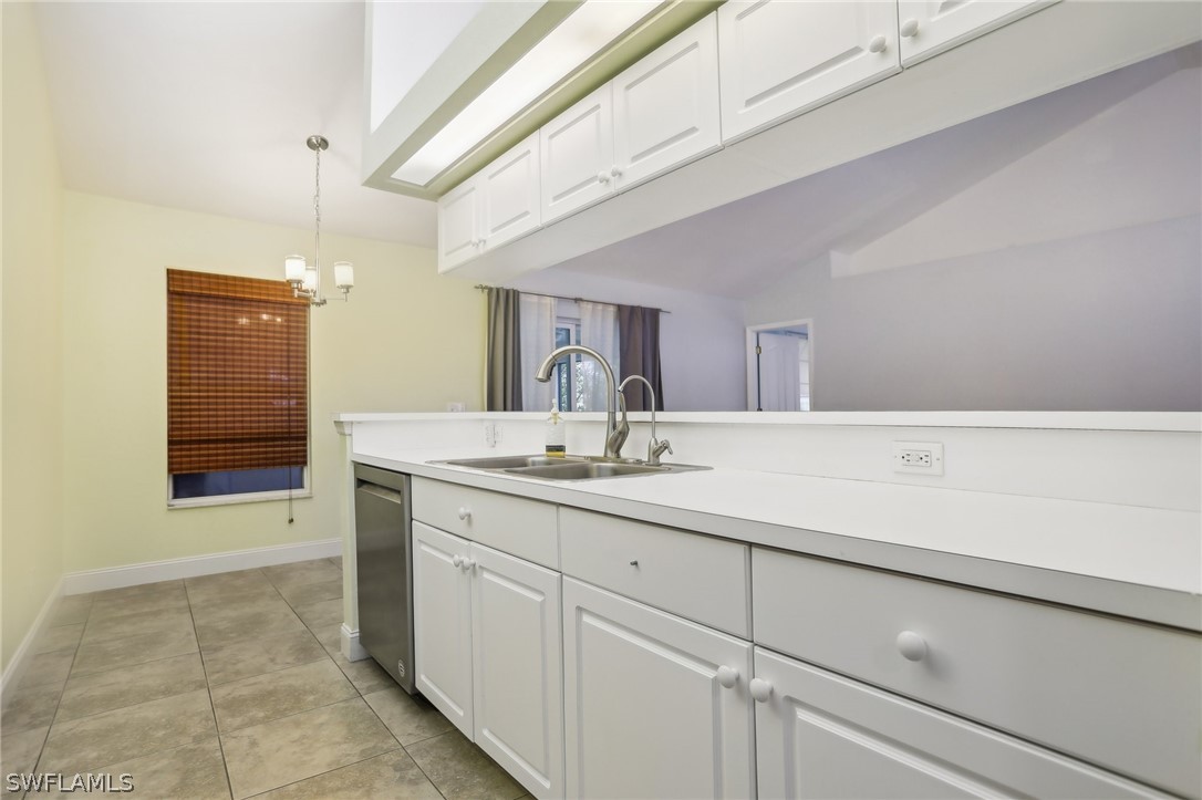18364 Camellia Road Fort Myers, FL 33967 - Photo 16 of 48 a bathroom with a sink and a mirror