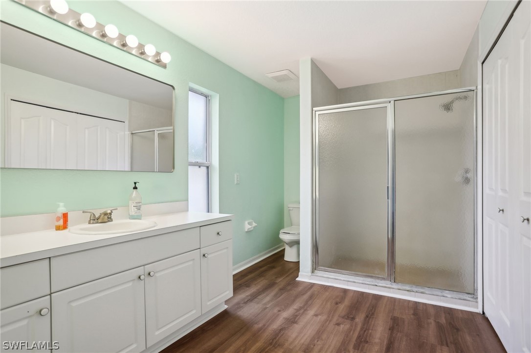 18364 Camellia Road Fort Myers, FL 33967 - Photo 19 of 48 a bathroom with a double vanity sink mirror and toilet