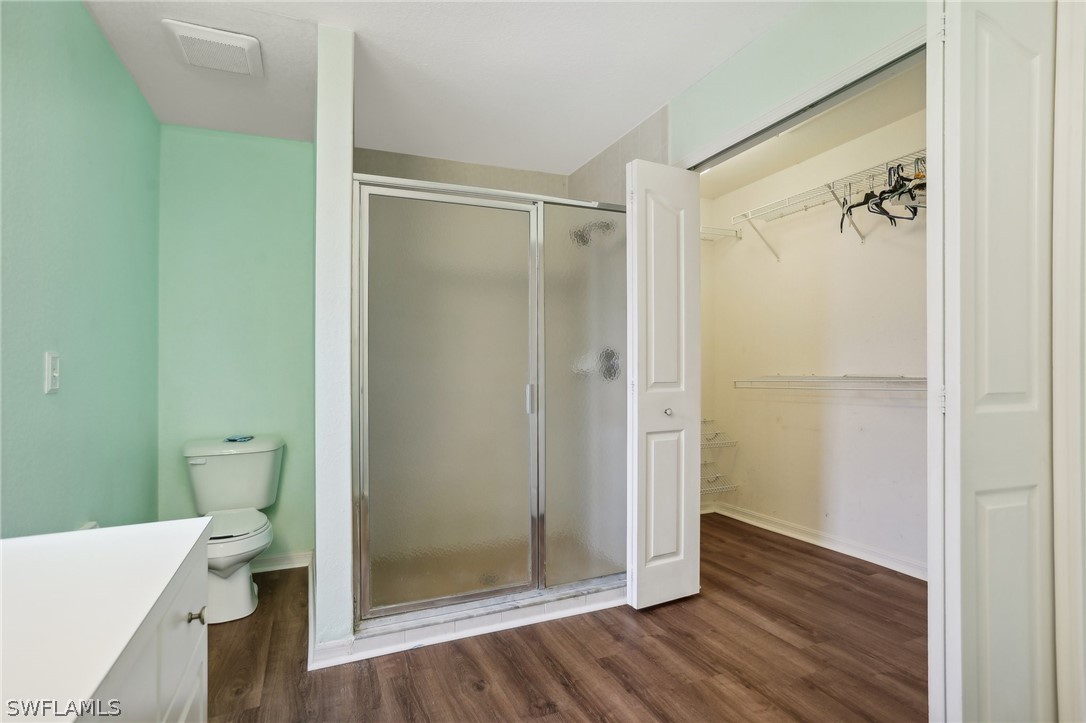 18364 Camellia Road Fort Myers, FL 33967 - Photo 20 of 48 a bathroom with a glass shower door
