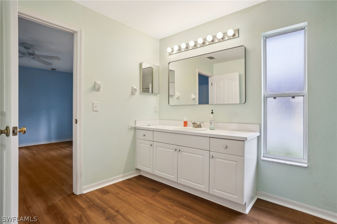 18364 Camellia Road Fort Myers, FL 33967 - Photo 21 of 48 a bathroom with a double vanity sink and mirror