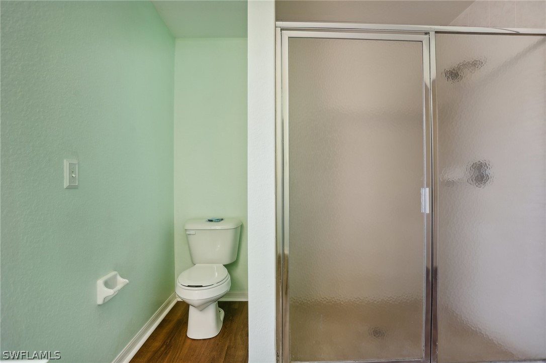18364 Camellia Road Fort Myers, FL 33967 - Photo 22 of 48 a bathroom with a toilet and a shower