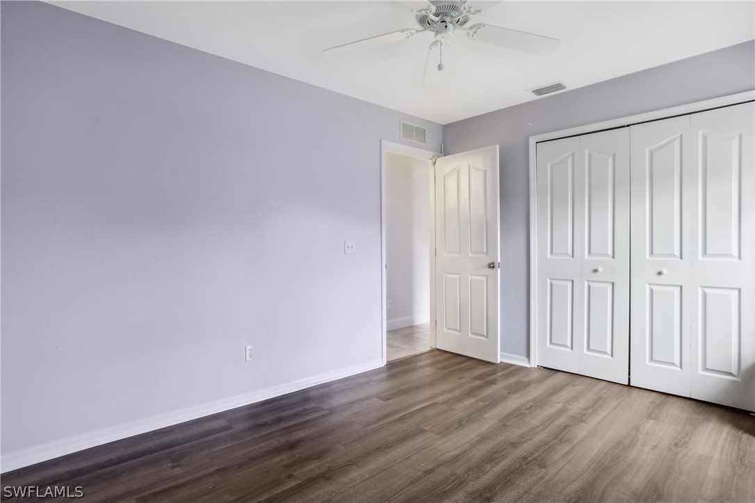 18364 Camellia Road Fort Myers, FL 33967 - Photo 26 of 48 a view of an empty room with wooden floor