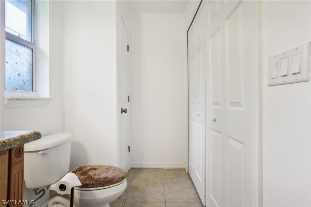 18364 Camellia Road Fort Myers, FL 33967 - Photo 34 of 48 a bathroom with a toilet and a shower