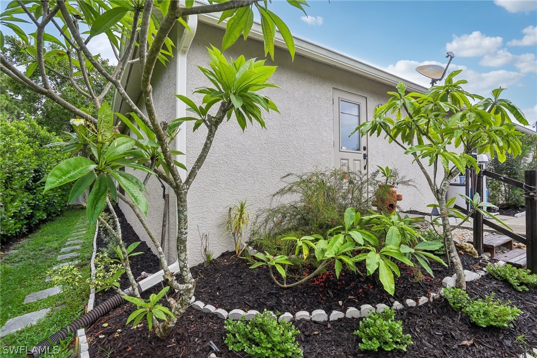 18364 Camellia Road Fort Myers, FL 33967 - Photo 40 of 48 a plant that is in front of the house