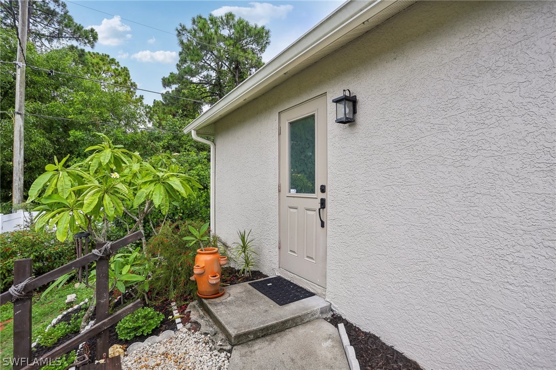 18364 Camellia Road Fort Myers, FL 33967 - Photo 4 of 48 a backyard of a house with seating space