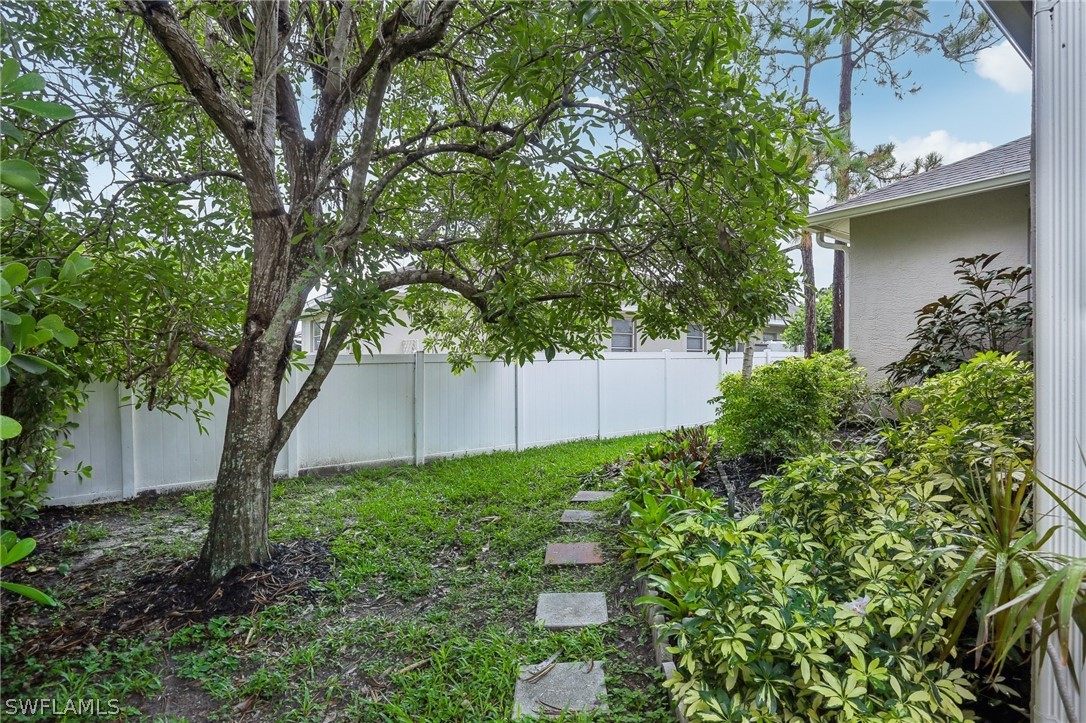 18364 Camellia Road Fort Myers, FL 33967 - Photo 44 of 48 a backyard of a house with lots of green space