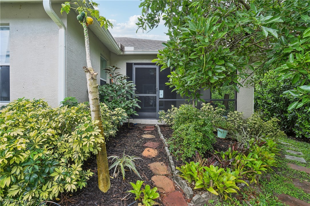 18364 Camellia Road Fort Myers, FL 33967 - Photo 45 of 48 front view of a house with a yard