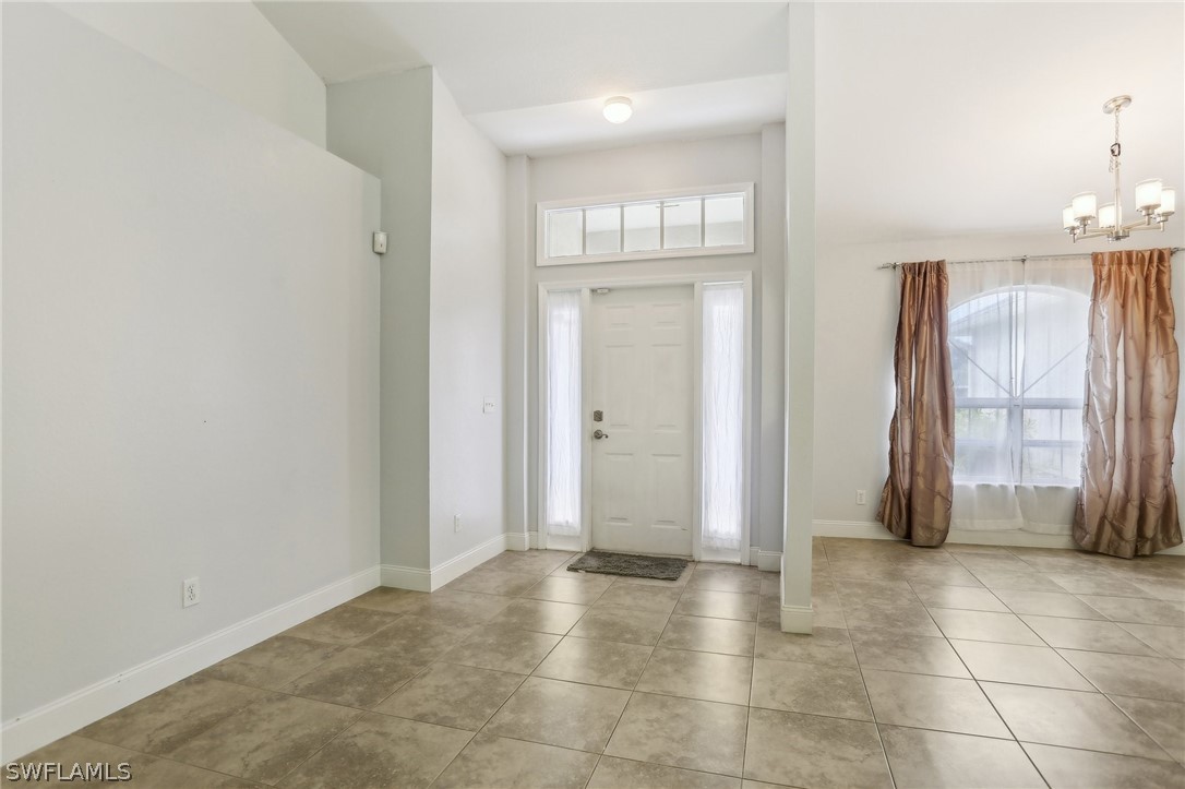 18364 Camellia Road Fort Myers, FL 33967 - Photo 5 of 48 an empty room with windows and closet