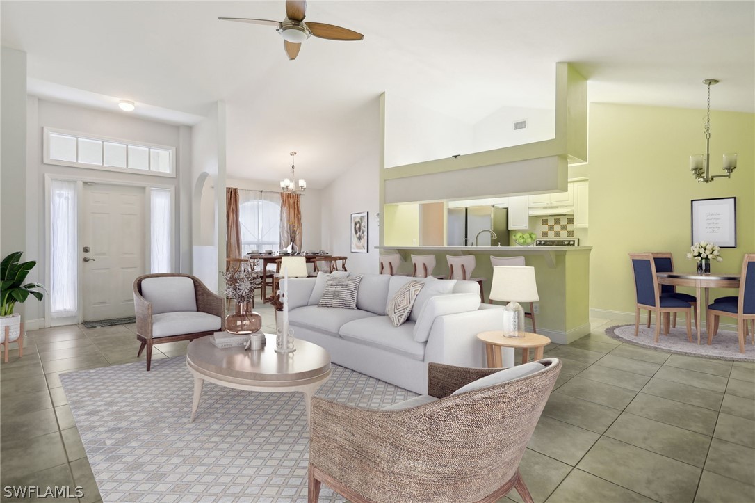 18364 Camellia Road Fort Myers, FL 33967 - Photo 6 of 48 a living room with furniture and a view of kitchen