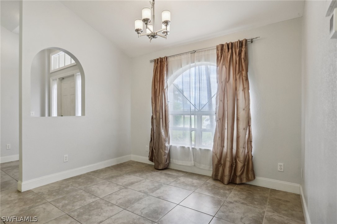 18364 Camellia Road Fort Myers, FL 33967 - Photo 8 of 48 an empty room with windows