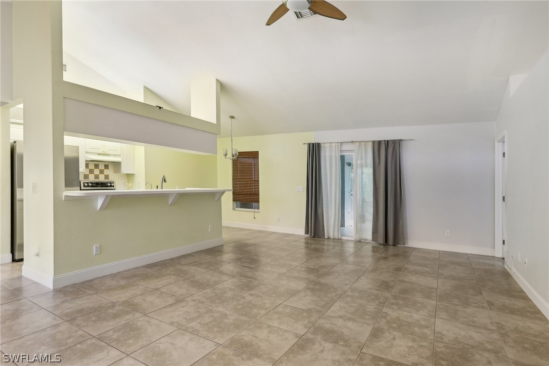 18364 Camellia Road Fort Myers, FL 33967 - Photo 9 of 48 a view of a kitchen with a refrigerator and a stove top oven