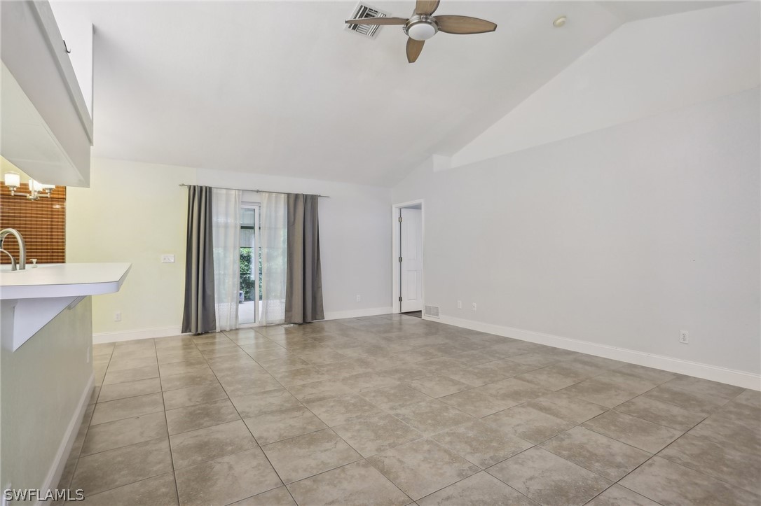 18364 Camellia Road Fort Myers, FL 33967 - Photo 10 of 48 a view of empty room with a fireplace