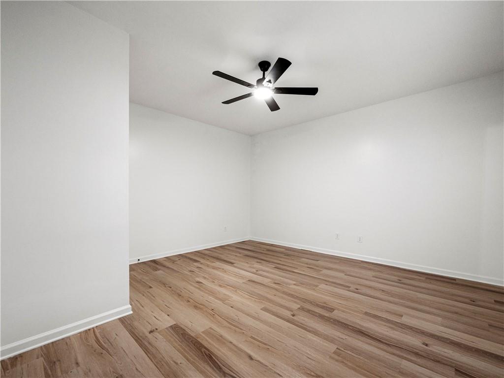 4334 Box Elder Path Gainesville, GA 30504 - Photo 29 of 39 a view of a big room with wooden floor