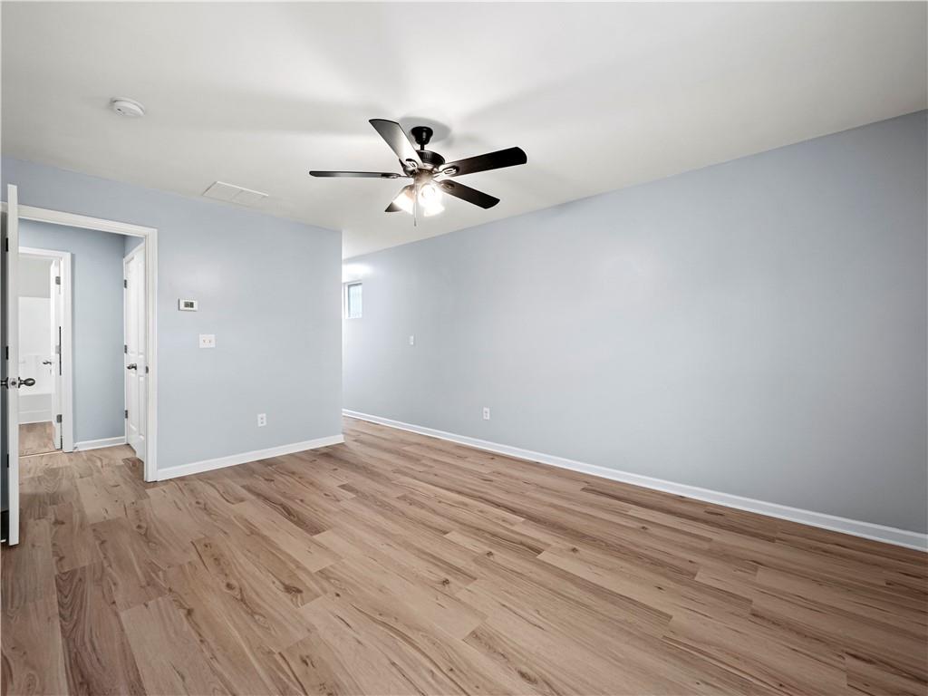 4334 Box Elder Path Gainesville, GA 30504 - Photo 32 of 39 a view of an empty room with wooden floor