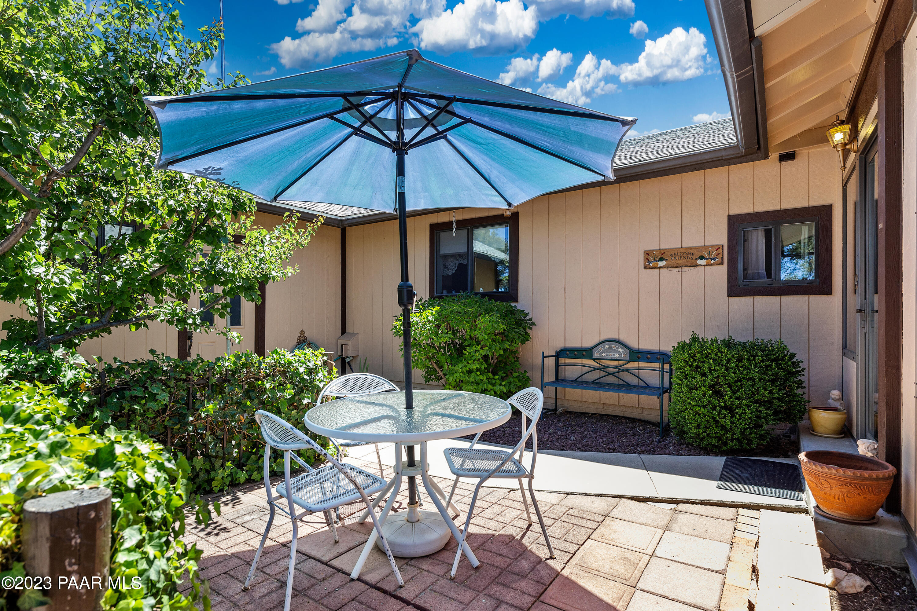2680 Ridge Road Prescott, AZ 86301 - Photo 2 of 25 a patio with a patio table and chairs