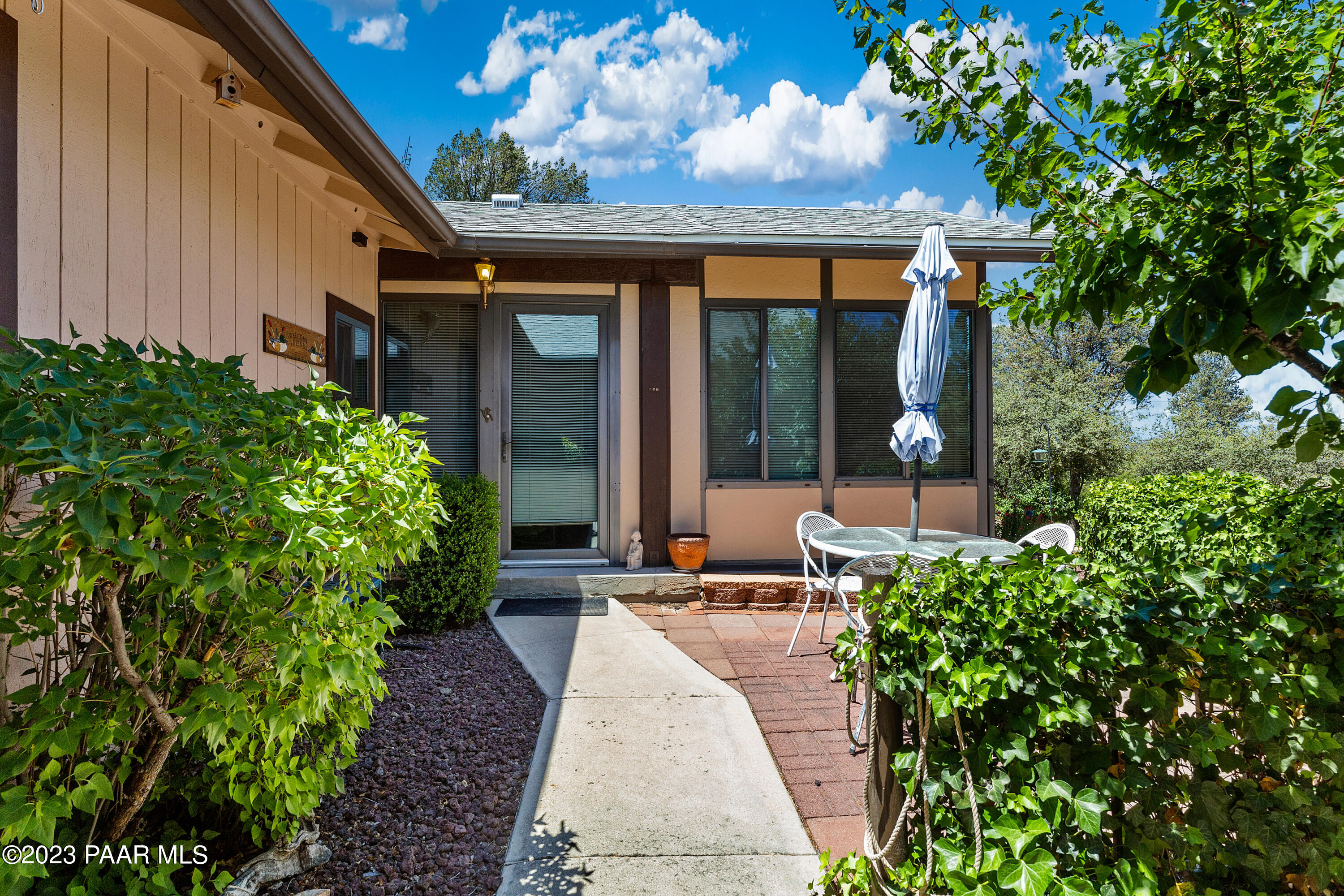 2680 Ridge Road Prescott, AZ 86301 - Photo 3 of 25 a view of a patio with couches table and chairs and potted plants