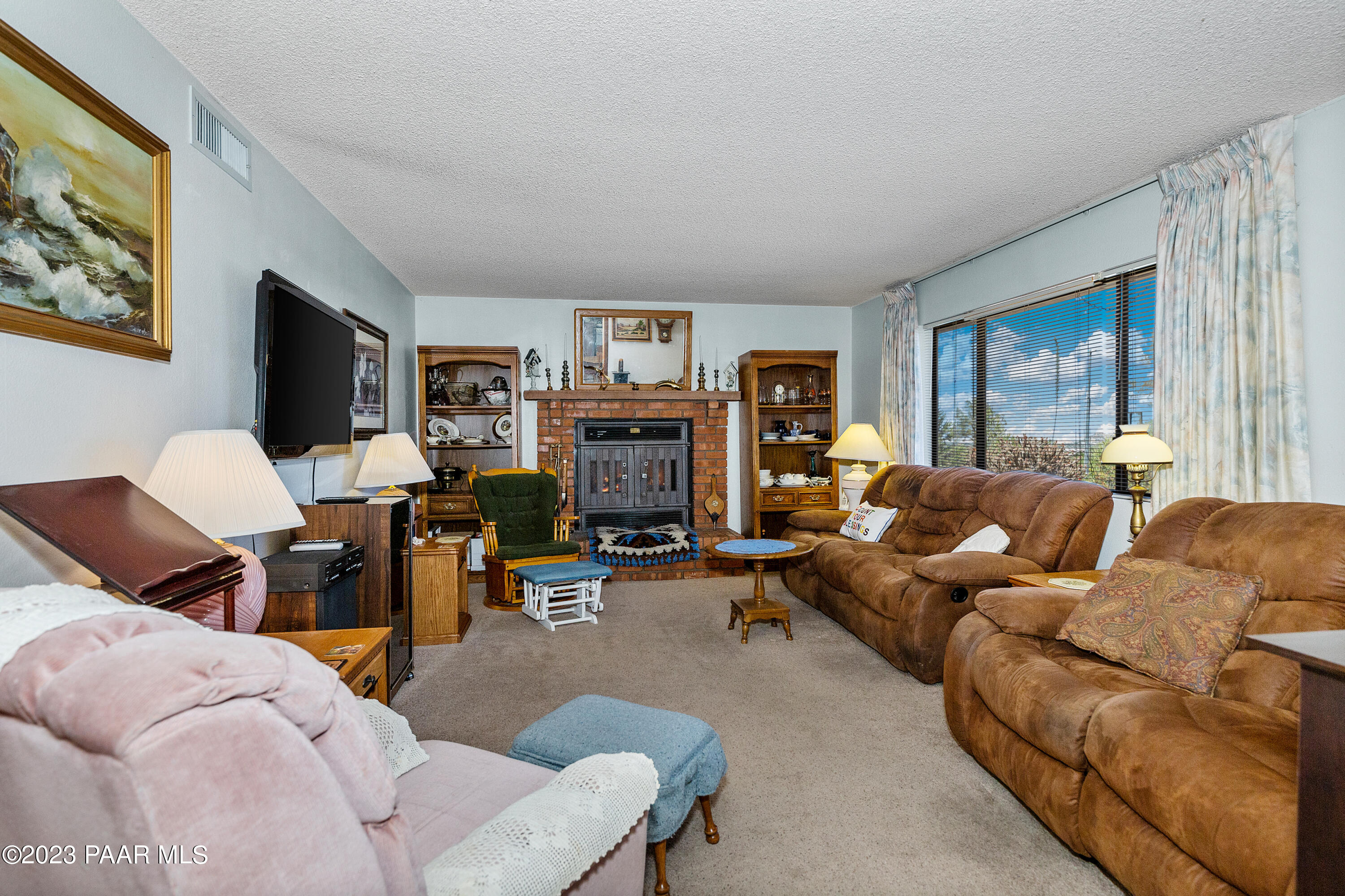 2680 Ridge Road Prescott, AZ 86301 - Photo 5 of 25 a living room with furniture kitchen view and a large window