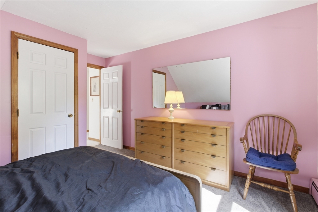 19 Mockingbird Lane Maynard, MA 01754 - Photo 19 of 34 a bedroom with a bed and a dresser