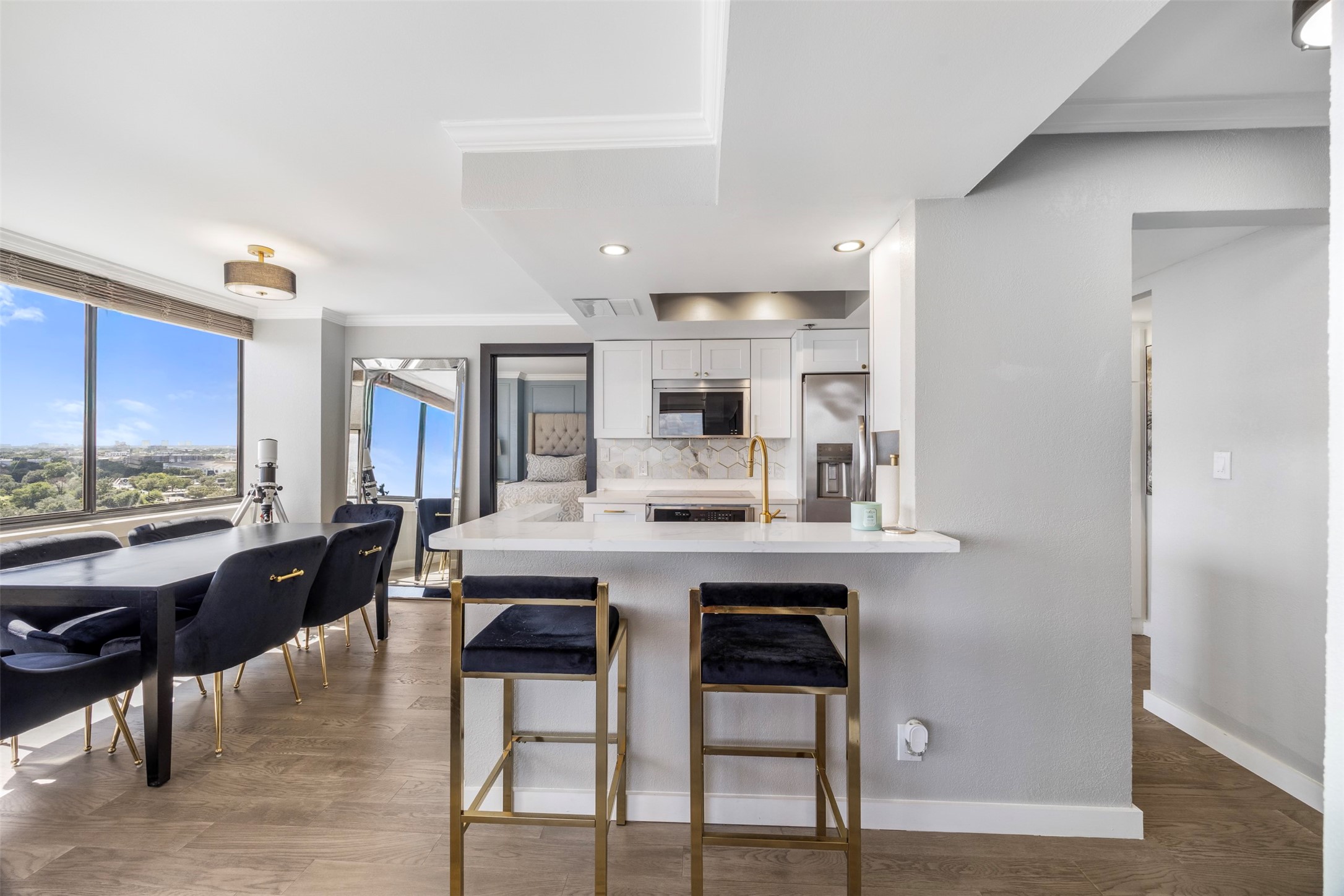 3525 Sage Road, Unit 1403 Houston, TX 77056 - Photo 11 of 47 a living room with stainless steel appliances furniture a rug and a kitchen view