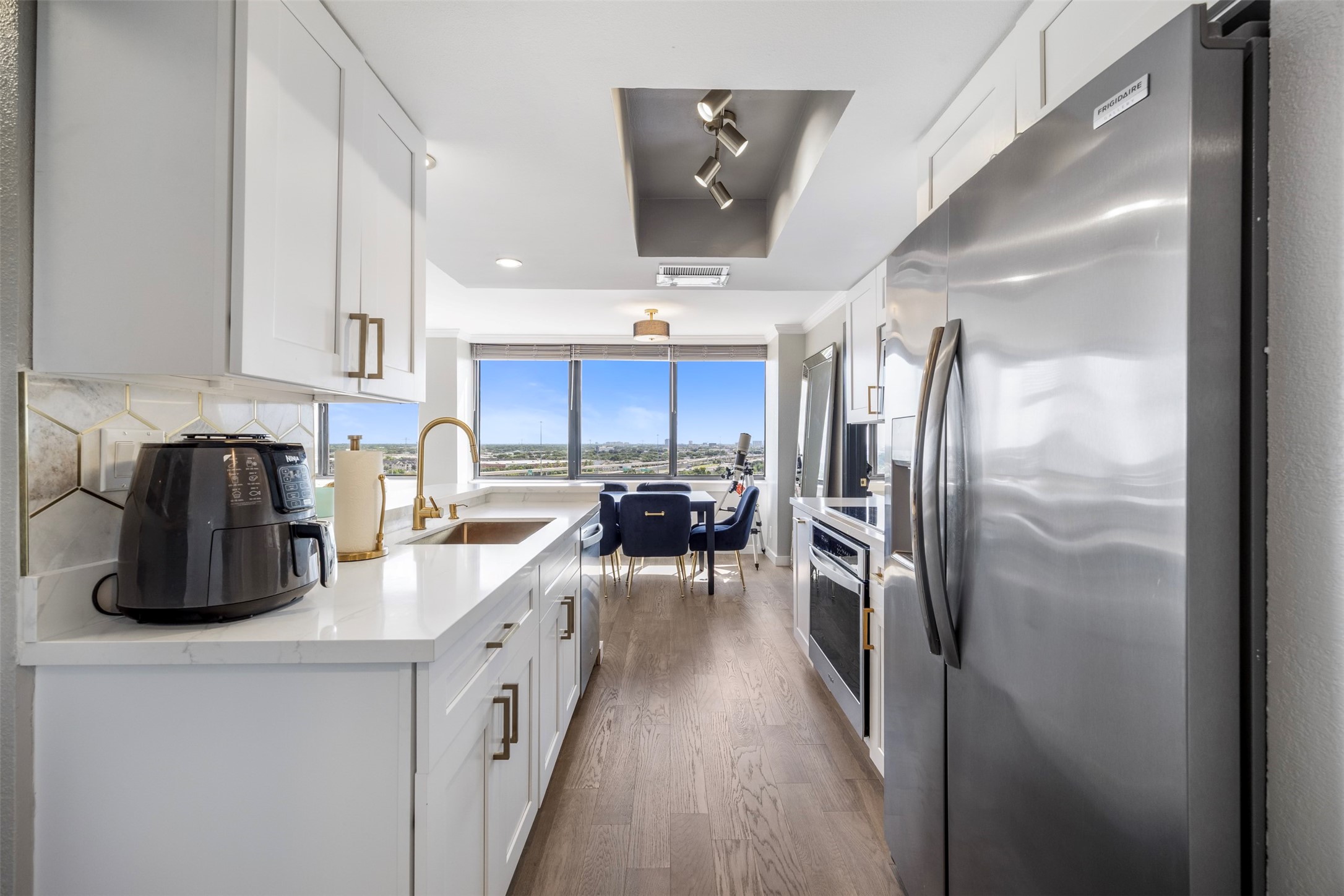 3525 Sage Road, Unit 1403 Houston, TX 77056 - Photo 13 of 47 a kitchen with cabinets and stainless steel appliances