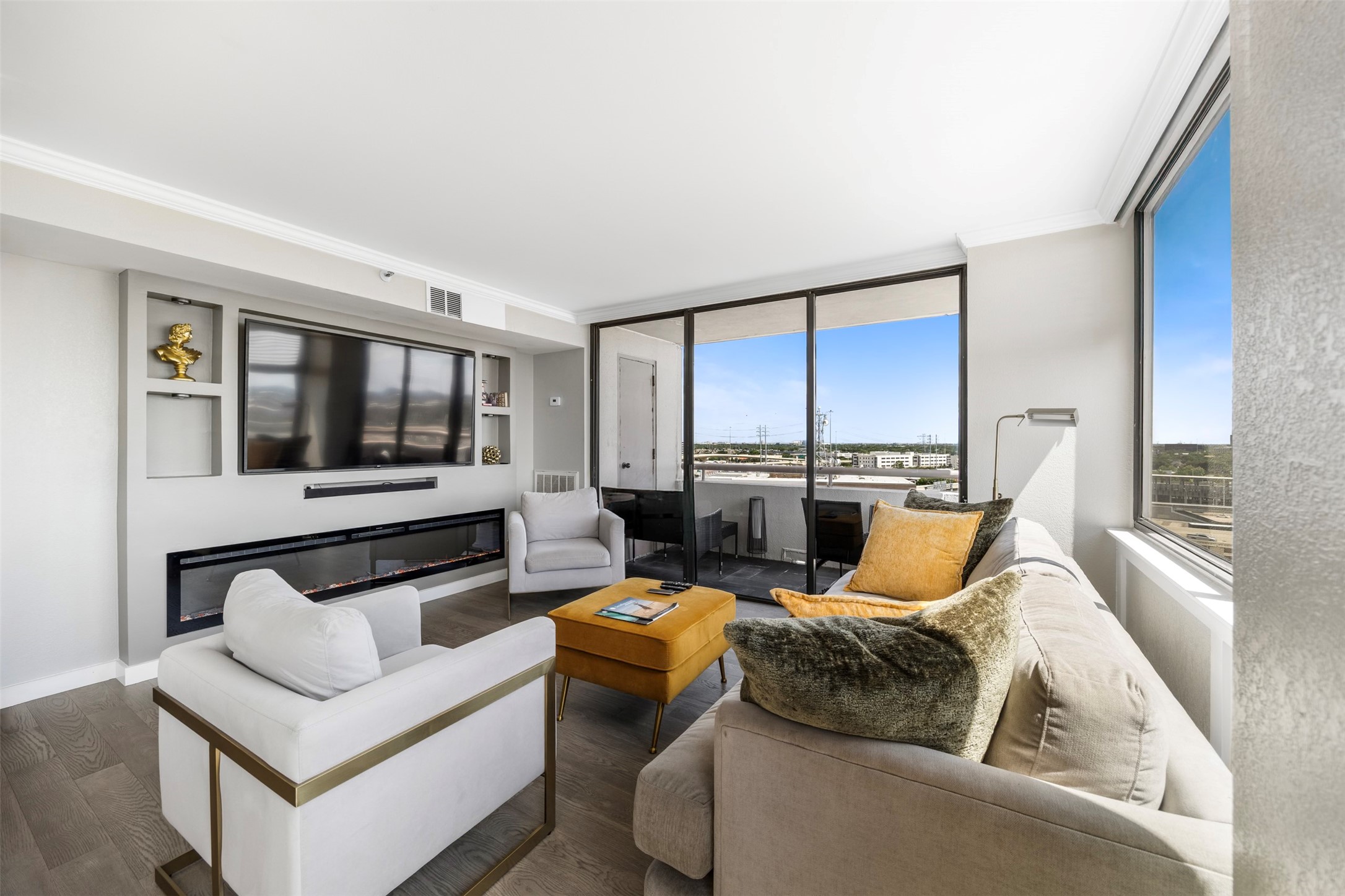 3525 Sage Road, Unit 1403 Houston, TX 77056 - Photo 2 of 47 a living room with furniture and a flat screen tv