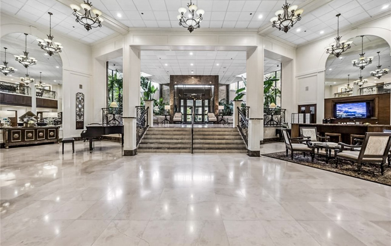 3525 Sage Road, Unit 1403 Houston, TX 77056 - Photo 36 of 47 a living room with fireplace furniture and a chandelier