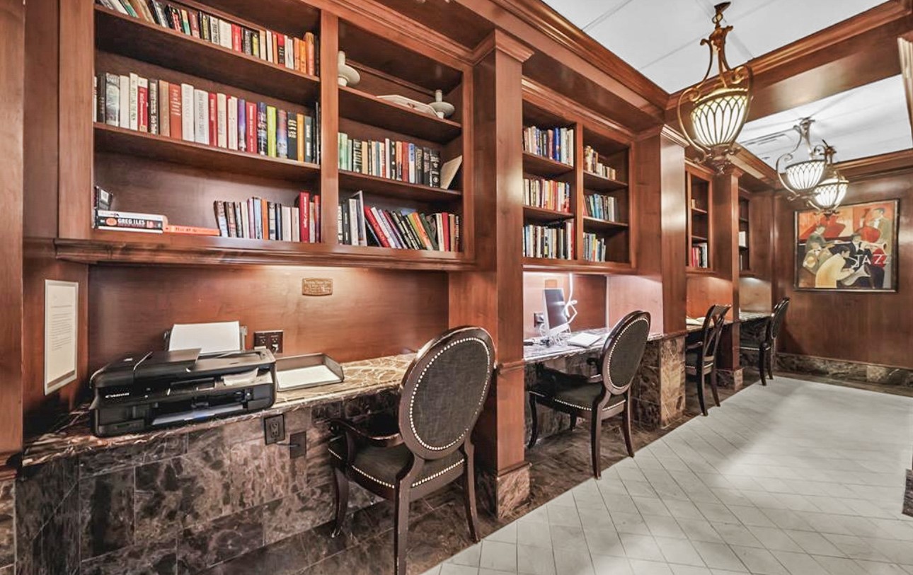 3525 Sage Road, Unit 1403 Houston, TX 77056 - Photo 39 of 47 a dining room with furniture and a book shelf