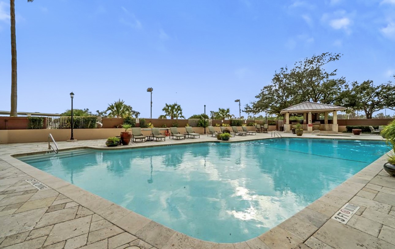 3525 Sage Road, Unit 1403 Houston, TX 77056 - Photo 42 of 47 a view of a swimming pool with an ocean view