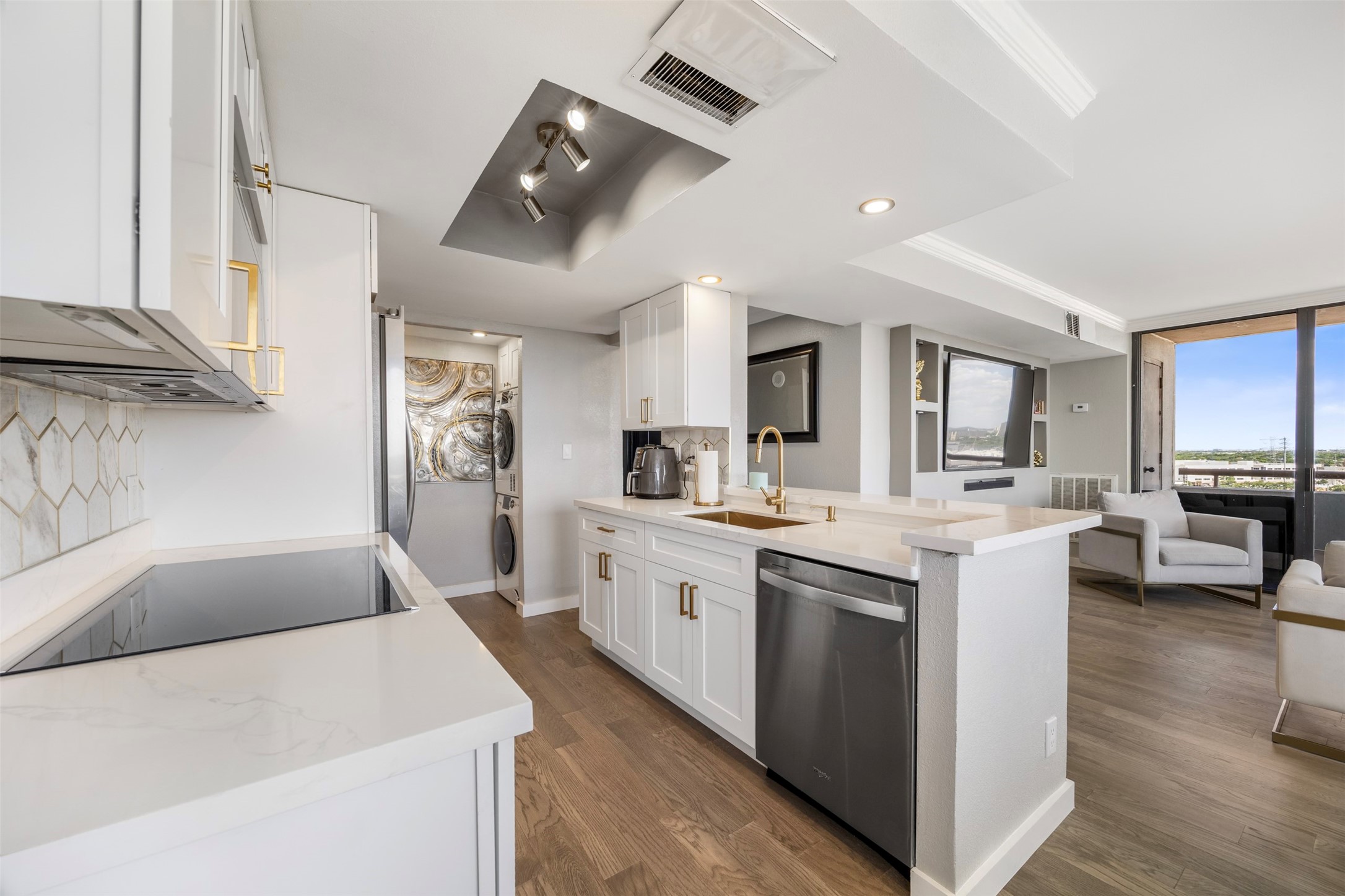 3525 Sage Road, Unit 1403 Houston, TX 77056 - Photo 7 of 47 a large white kitchen with cabinets a sink and appliances