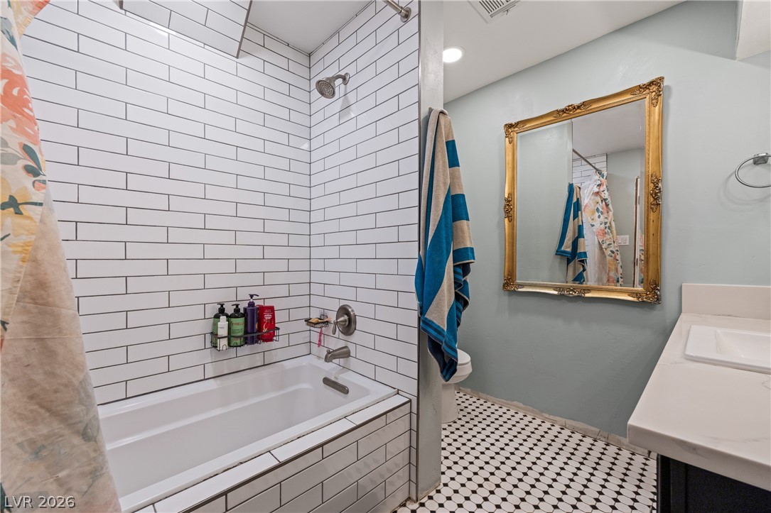 750 Leming Avenue Overton, NV 89040 - Photo 38 of 82 This bathroom features classic subway tile and charming patterned floor tiles.