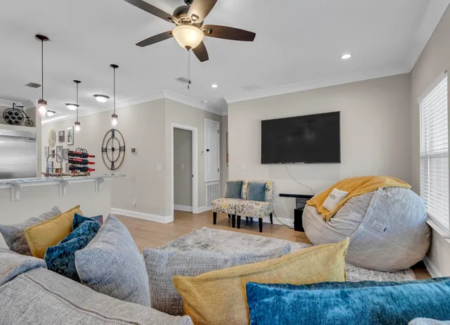 a kitchen with stainless steel appliances kitchen island granite countertop a table and chairs in it