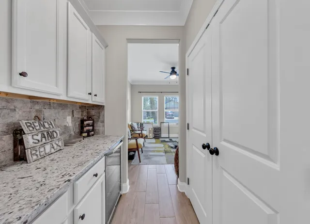 a bathroom with a granite countertop toilet sink and mirror