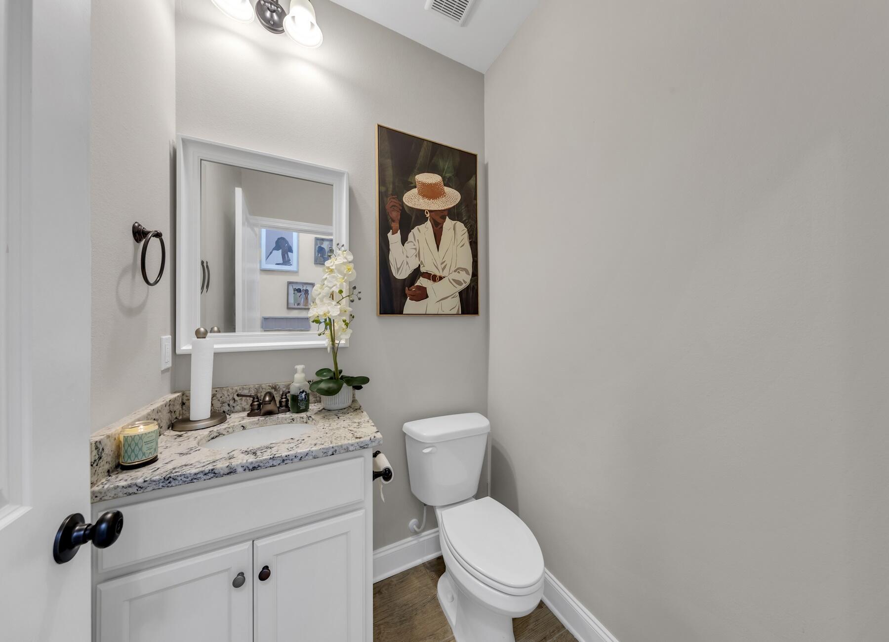 1200 French Quarter Way Fort Walton Beach, FL 32547 - Photo 20 of 45 a bathroom with a granite countertop toilet sink and mirror