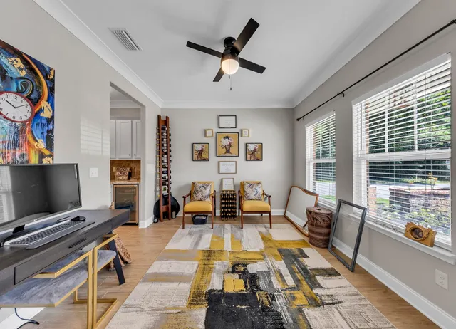 a living room with furniture and a window