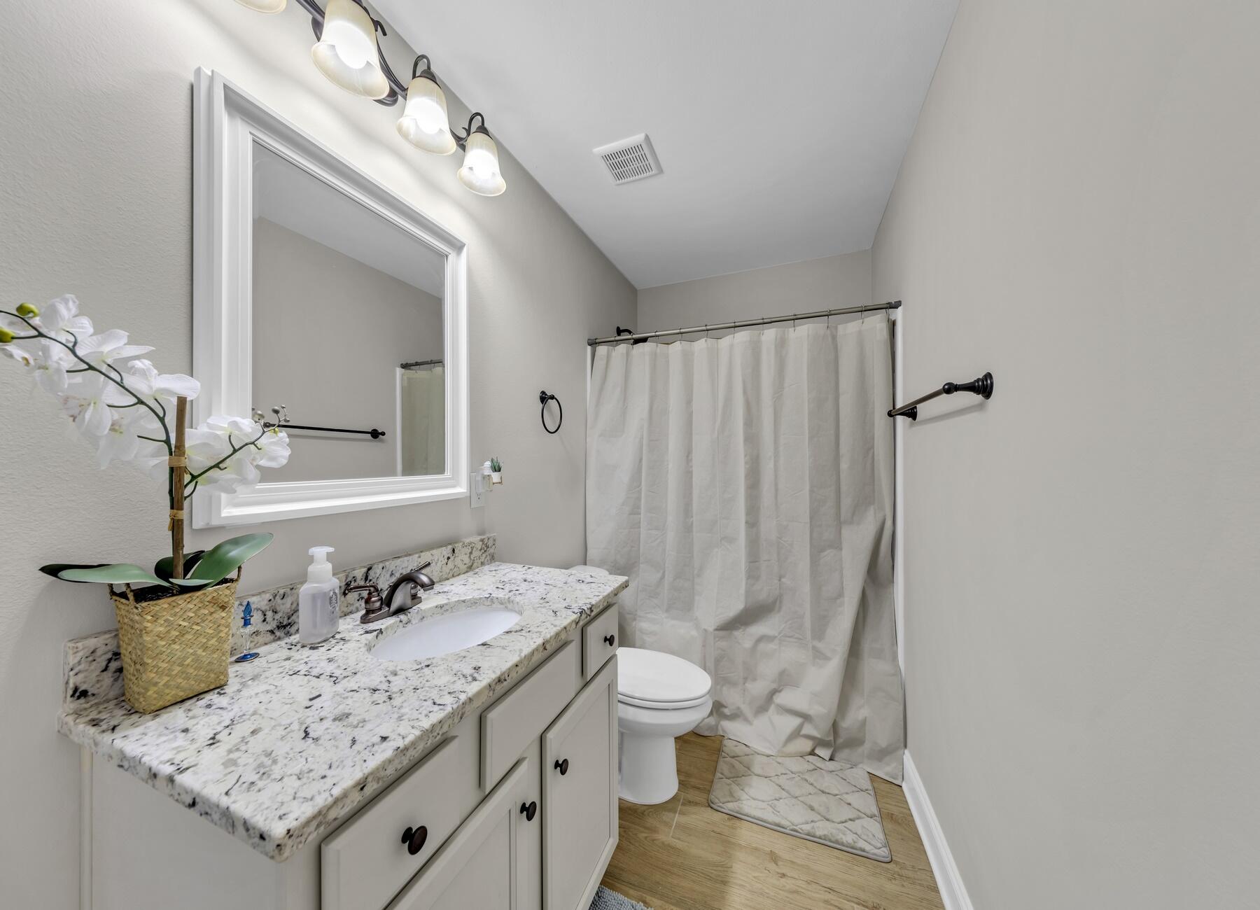 1200 French Quarter Way Fort Walton Beach, FL 32547 - Photo 23 of 45 a bathroom with a granite countertop sink and a mirror